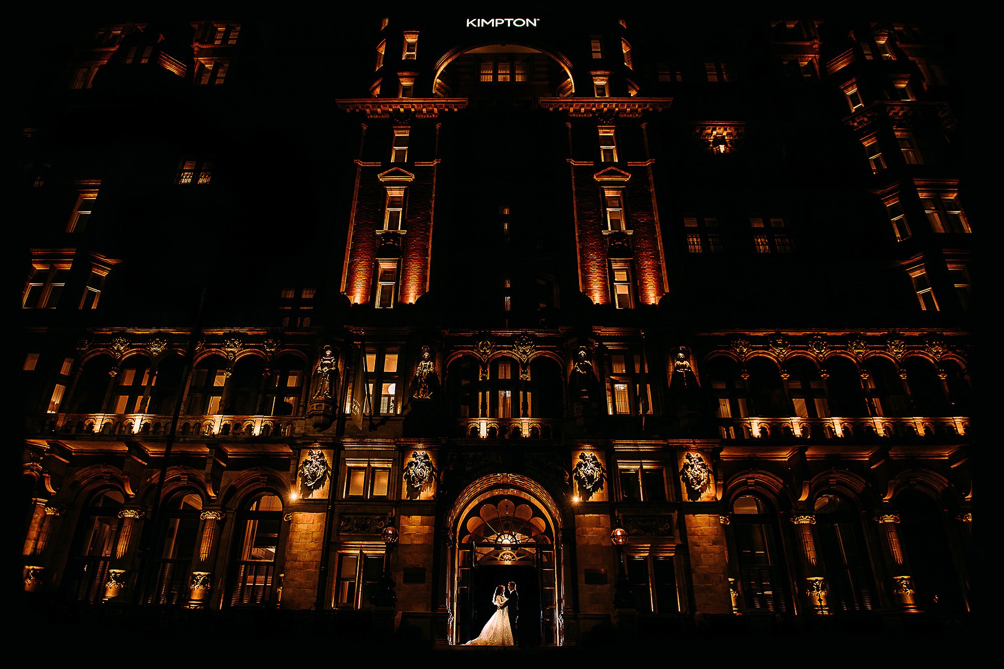  Night time portrait of the couple in front of the London Fitzroy. 