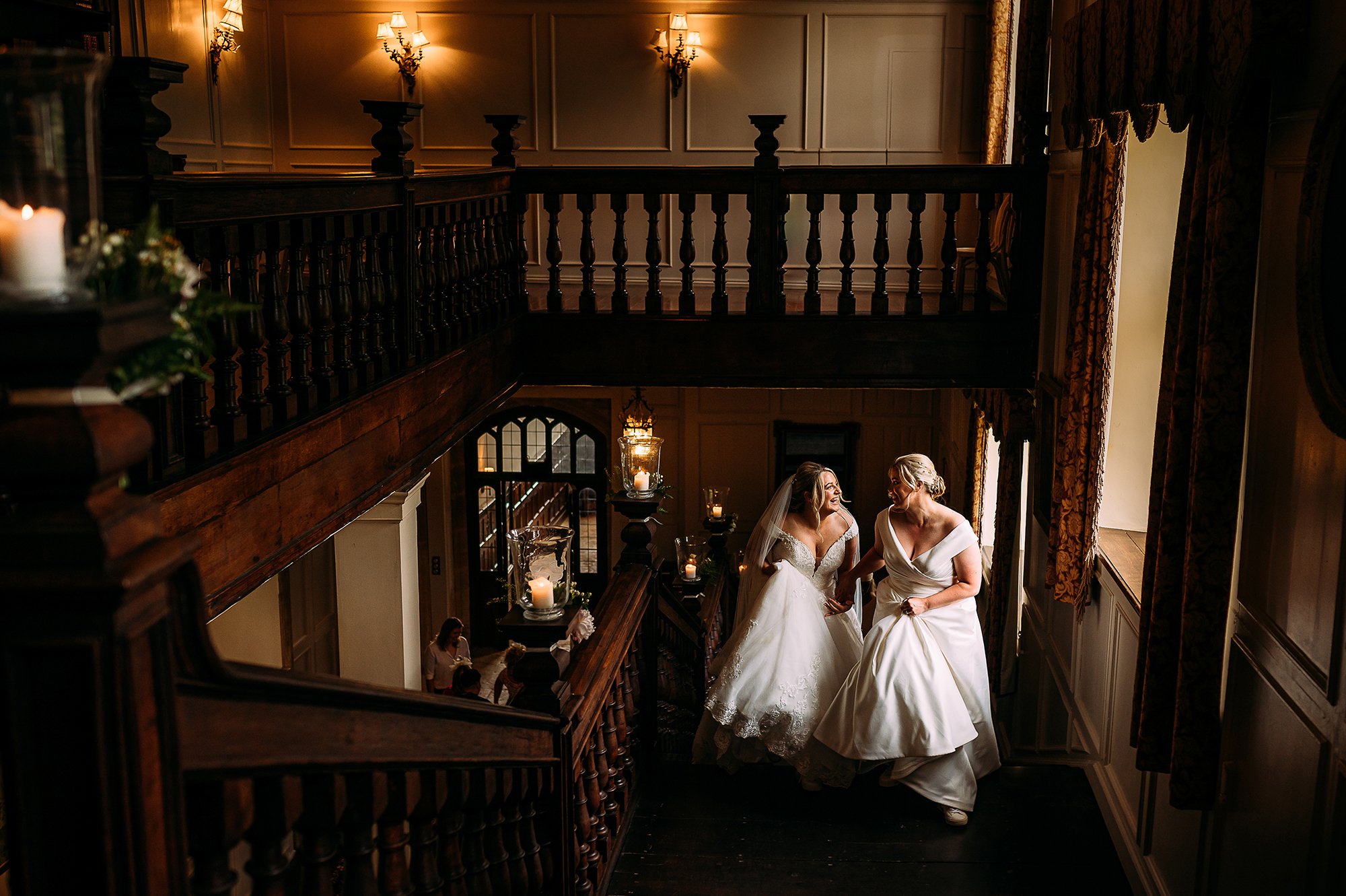  Brides walking up the stairs together at Brympton House. 