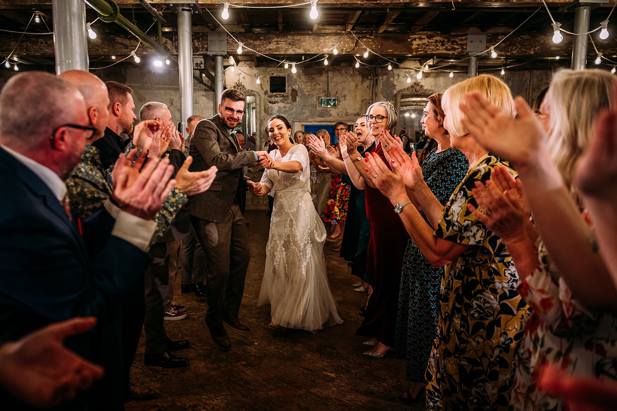  Couple dancing down an aisle at Holmes mill. 