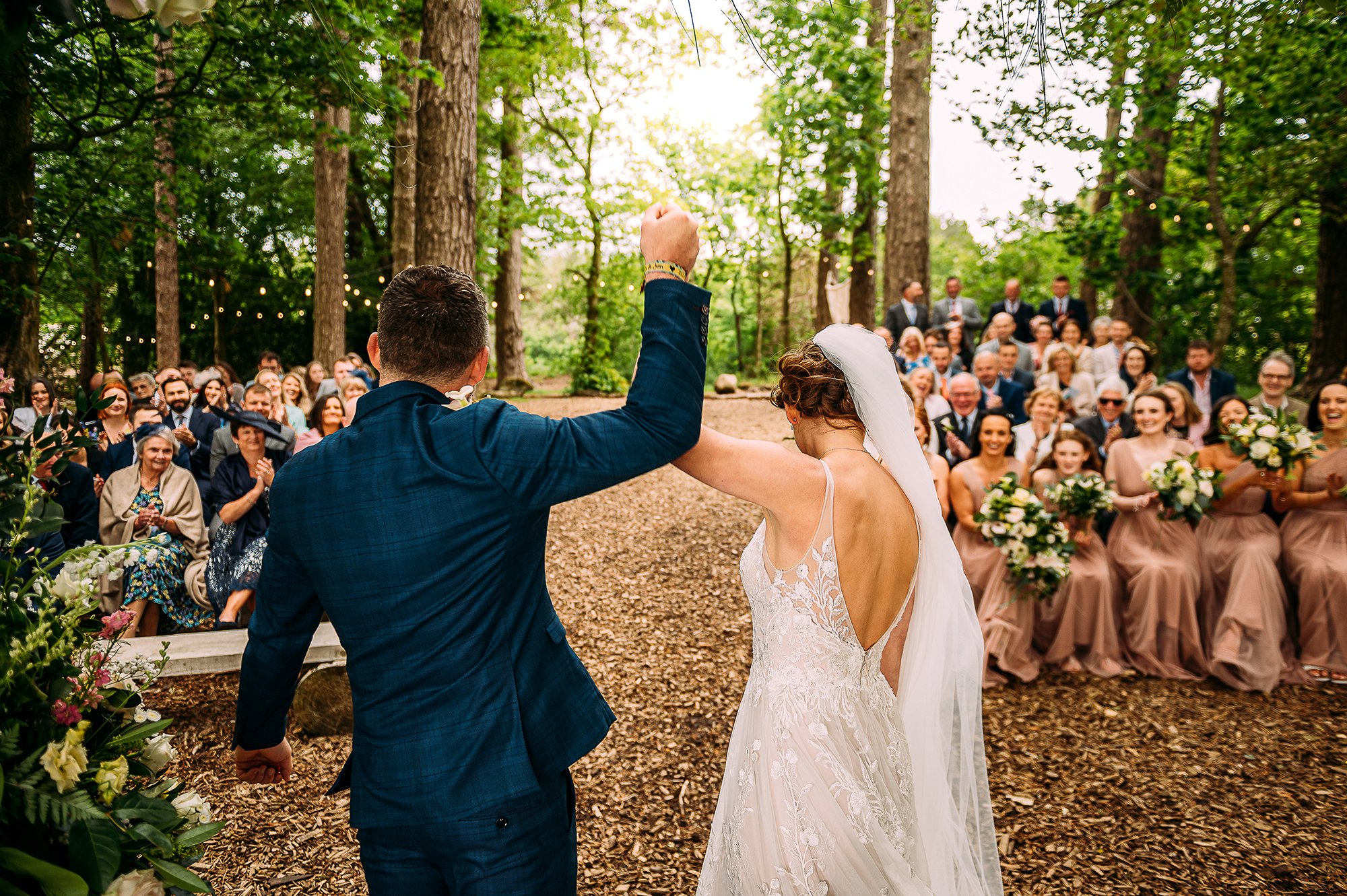  Couple lift their hands in the end as they are announced married. 