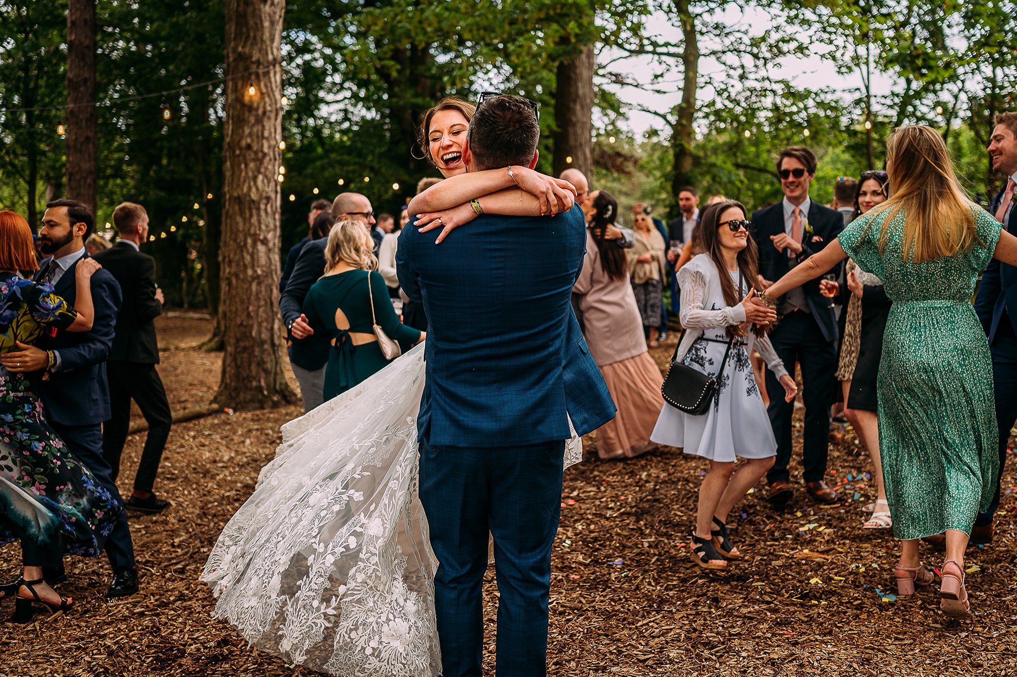  Groom lifts and spins his wife at the end of their first dance. 