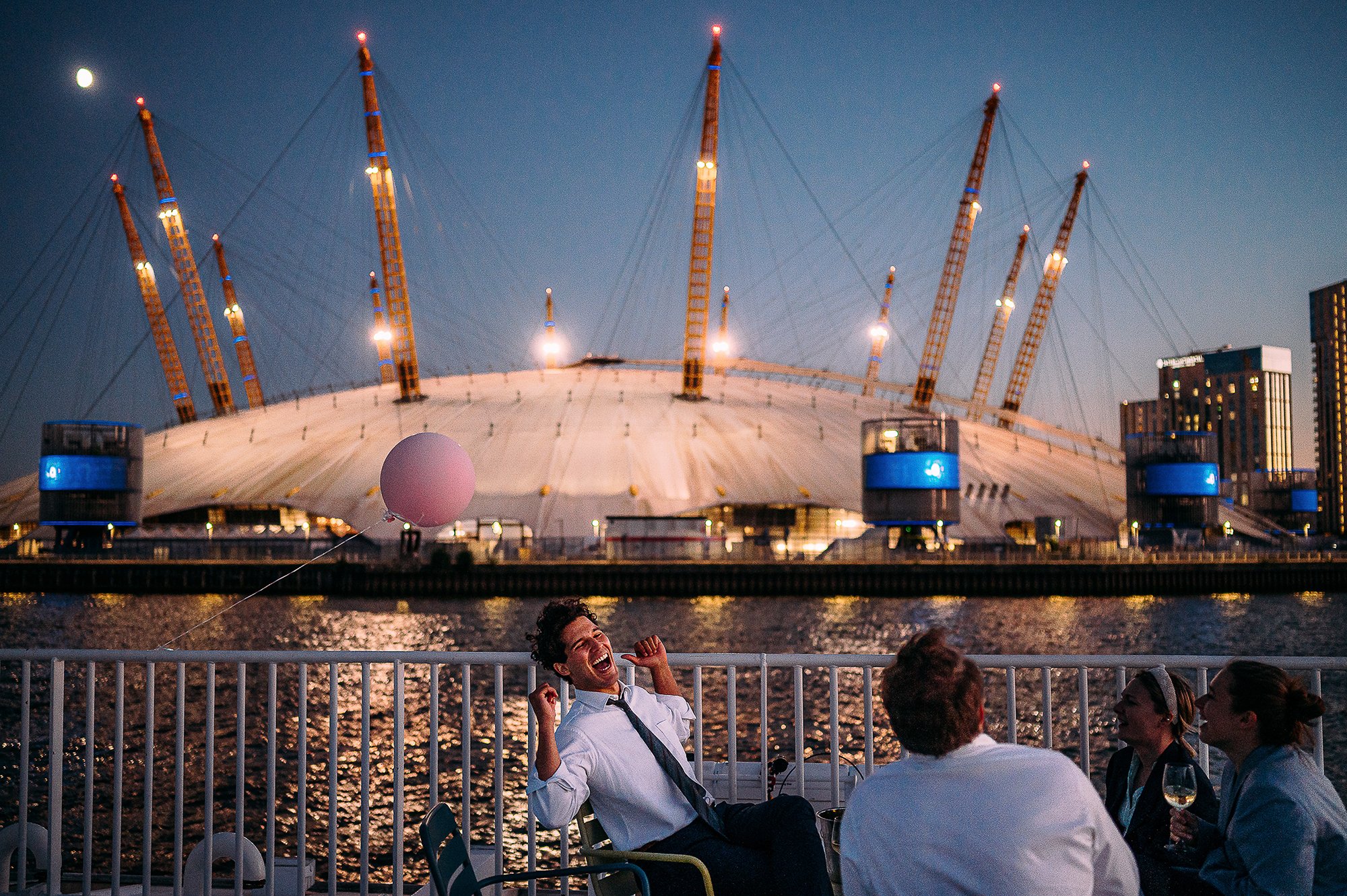  Guest laughing in front of the o2 arena. 