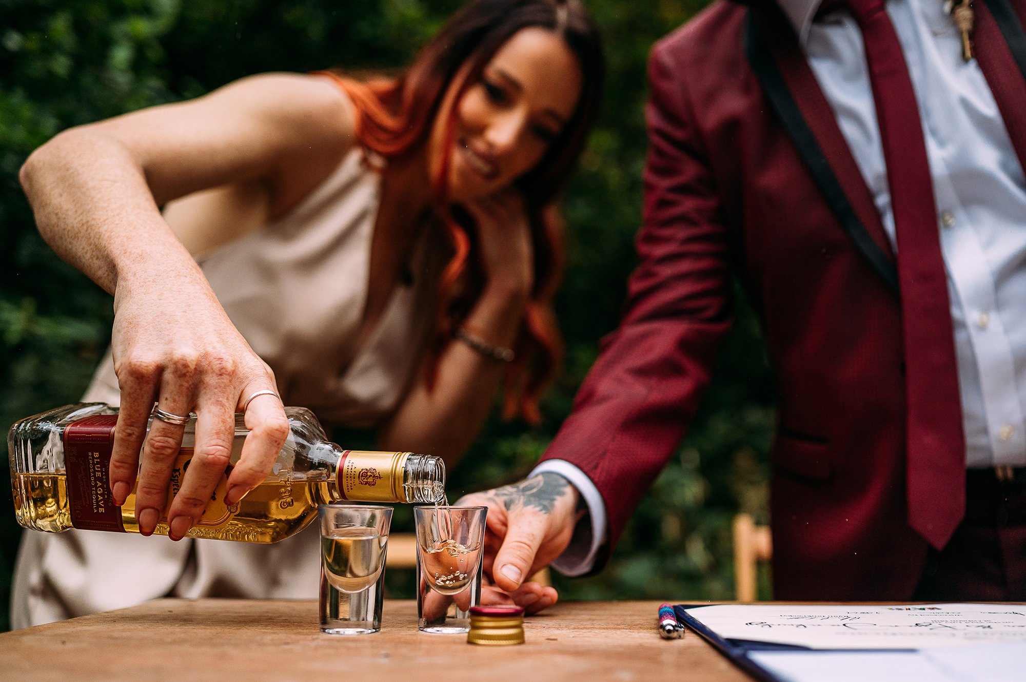  Bride pouring tequila to seal the marriage deal. 