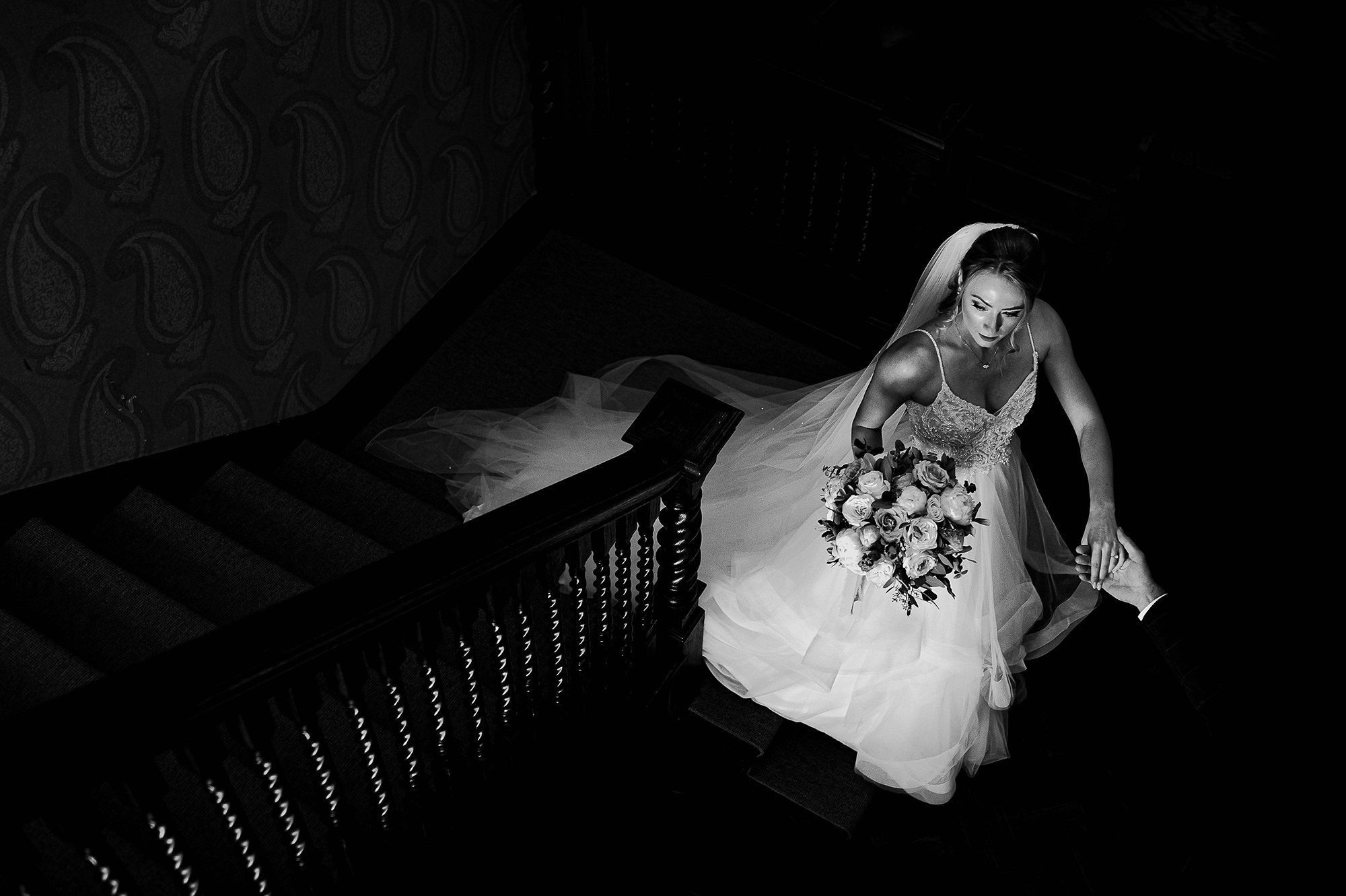  Bride walking down the stairs, taken from above. 