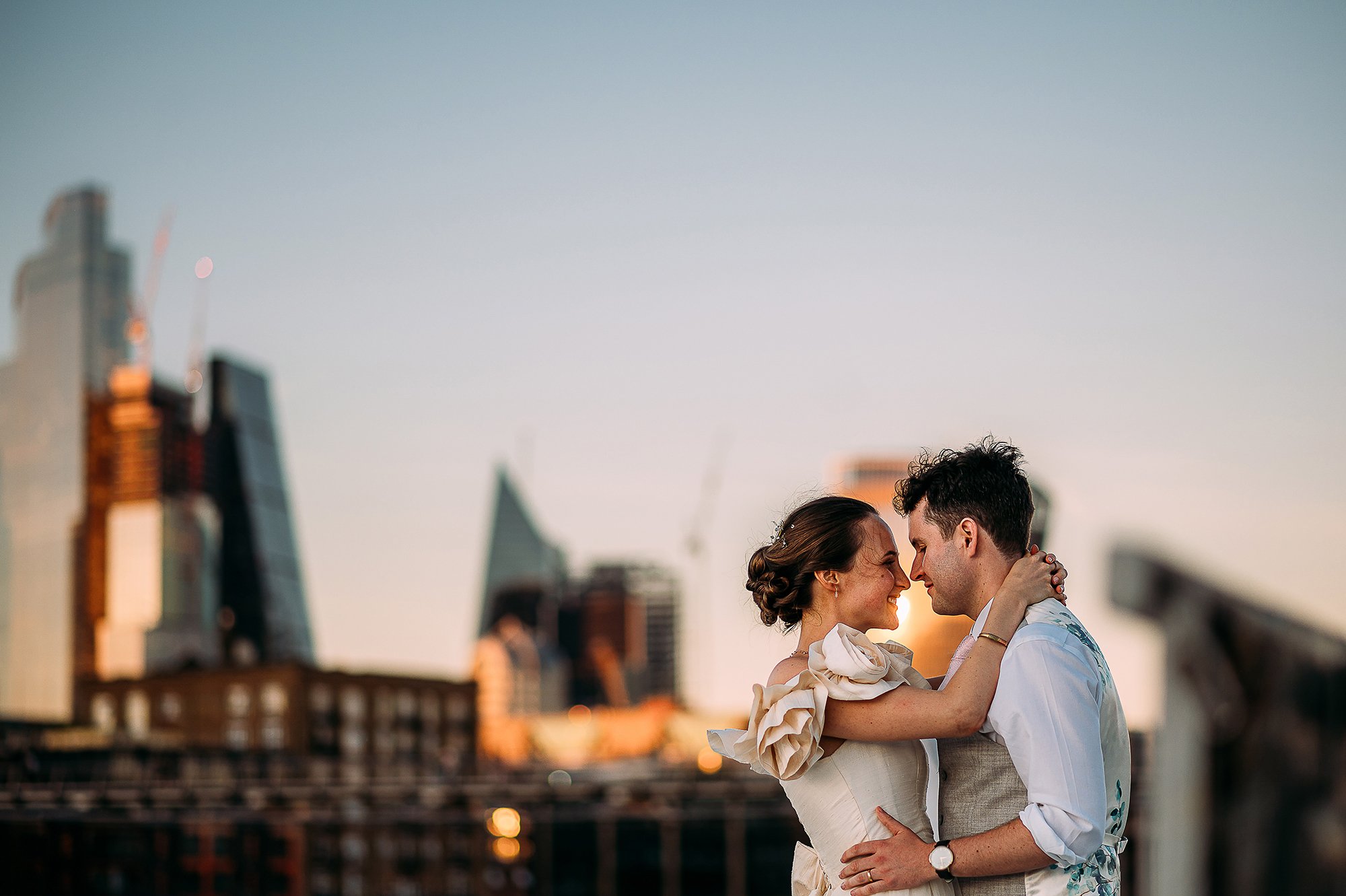  Couple portrait at dusk with London city in the background. 