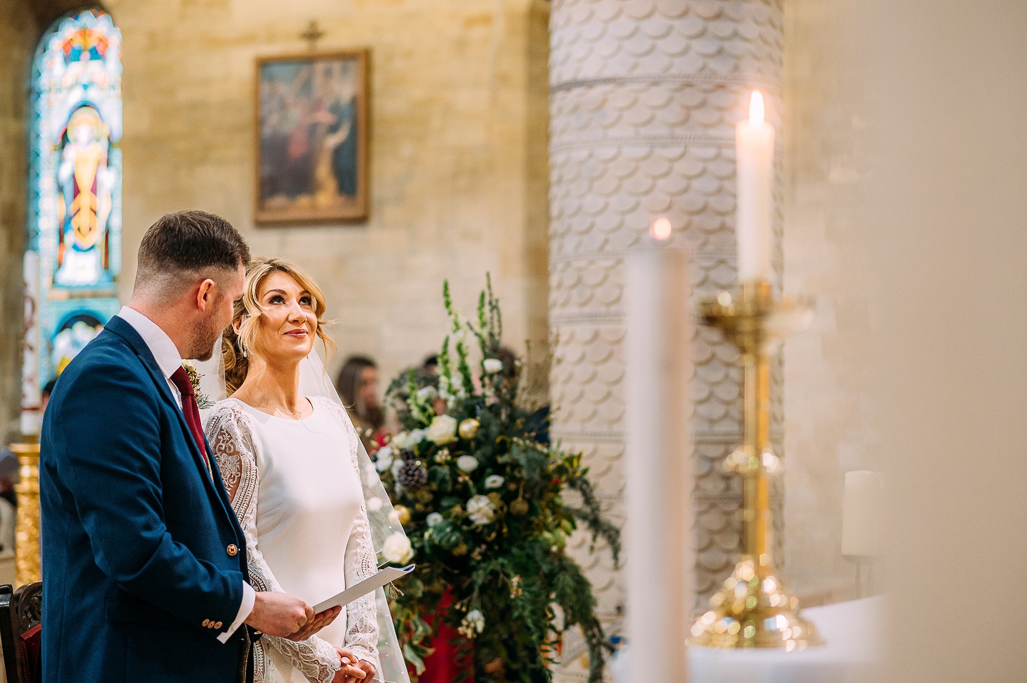  Bride glancing up to avoid tearing up in church. 