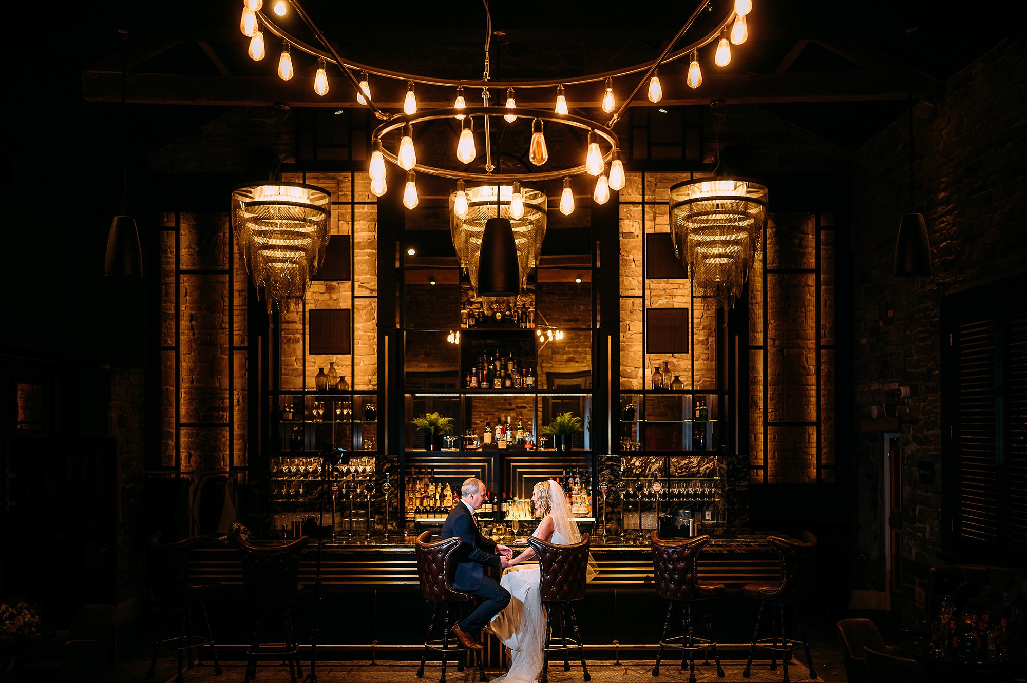  Couple sat having a drink at a gorgeous bar. 