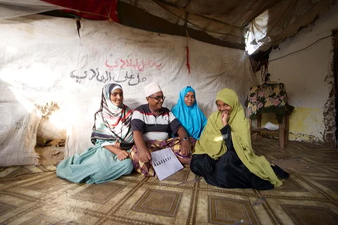Lula and her sisters and father at home