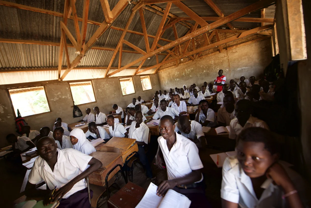 Kakumu Secondary School - crowded, few resources, buildings in disrepair, but students and teachers there at work