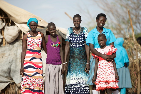 Sarah far right in blue blouse, with her family, Kakuma Refugee Camp photo: Jjumba Martin