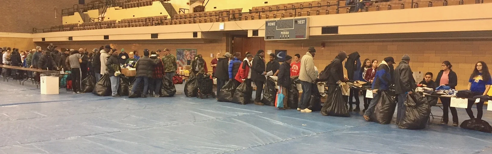 The line of homeless vets needing food, clothes, and services was this long, extending out the door and down the block for hours . 