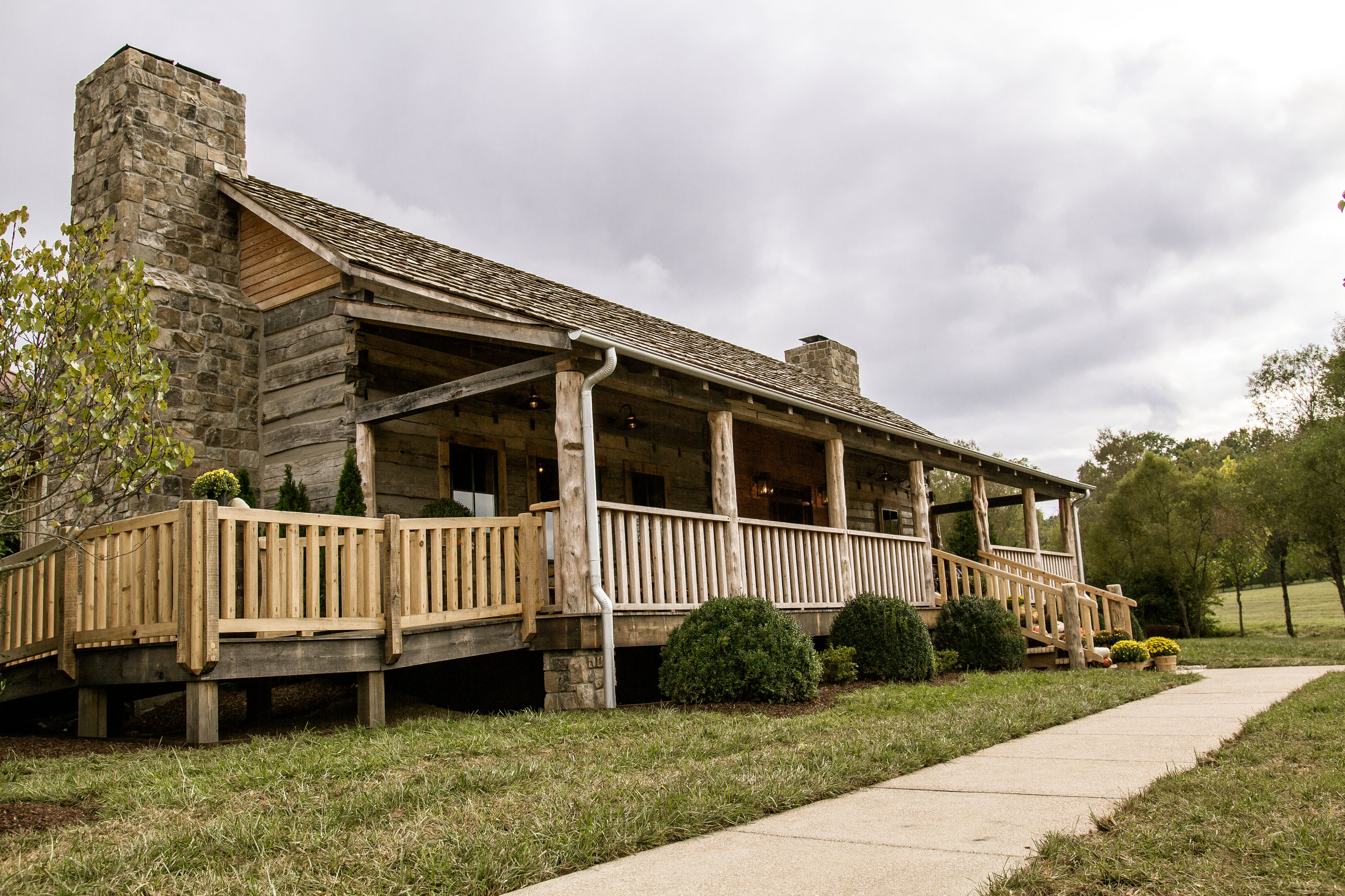 Our circa 1820-1825 cabin built by James Daniel from Yellow Creek (VanLeer) in Tennessee houses our gift shop, tasting room and offices.