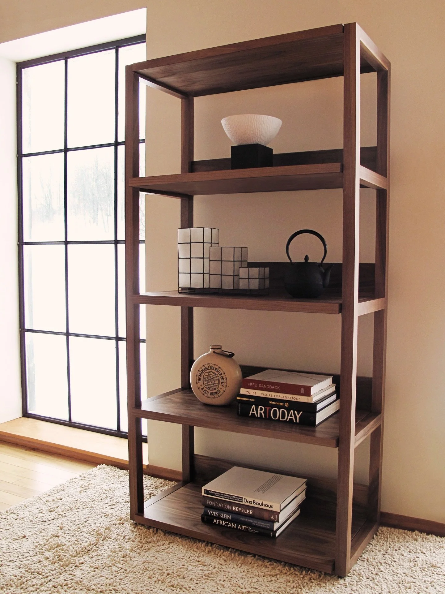 Strata Shelving in walnut. 
Elegant. Useful. Beautiful. 

#wallunit #bookshelf #shelvingsystem #officedesign #livingroom #customfurniture #woodfurniture #torontointeriordesign #customdesigns #highenddesign #spekeklein