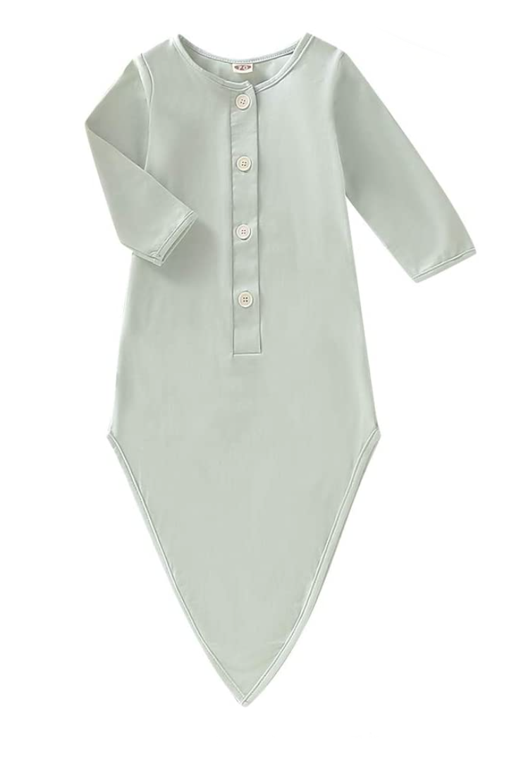 light green baby gown with buttons newborn photographer.png