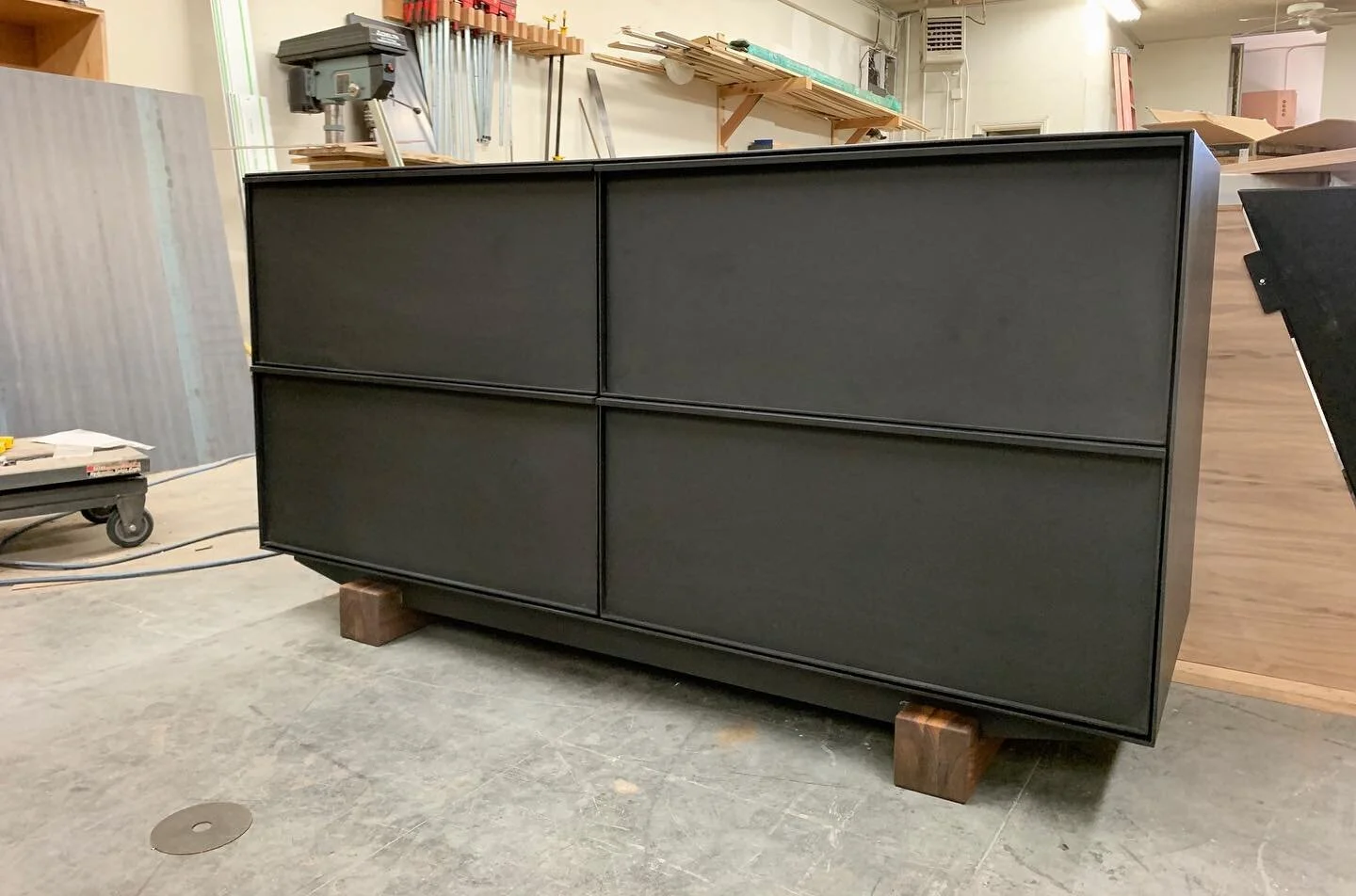 All black with pops of walnut for  this steel file cabinet. 🖤