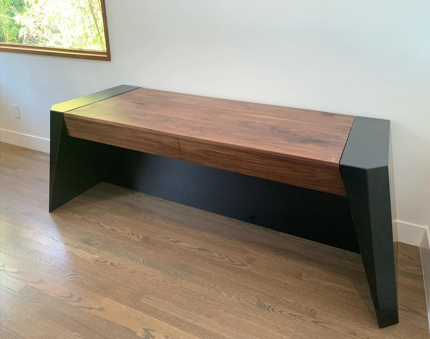 A concealed workstation for one of our lovely clients in Malibu. Black walnut and carved steel. Don&rsquo;t mind the screen set up brackets and wiring still have to be arranged. #rahdesign