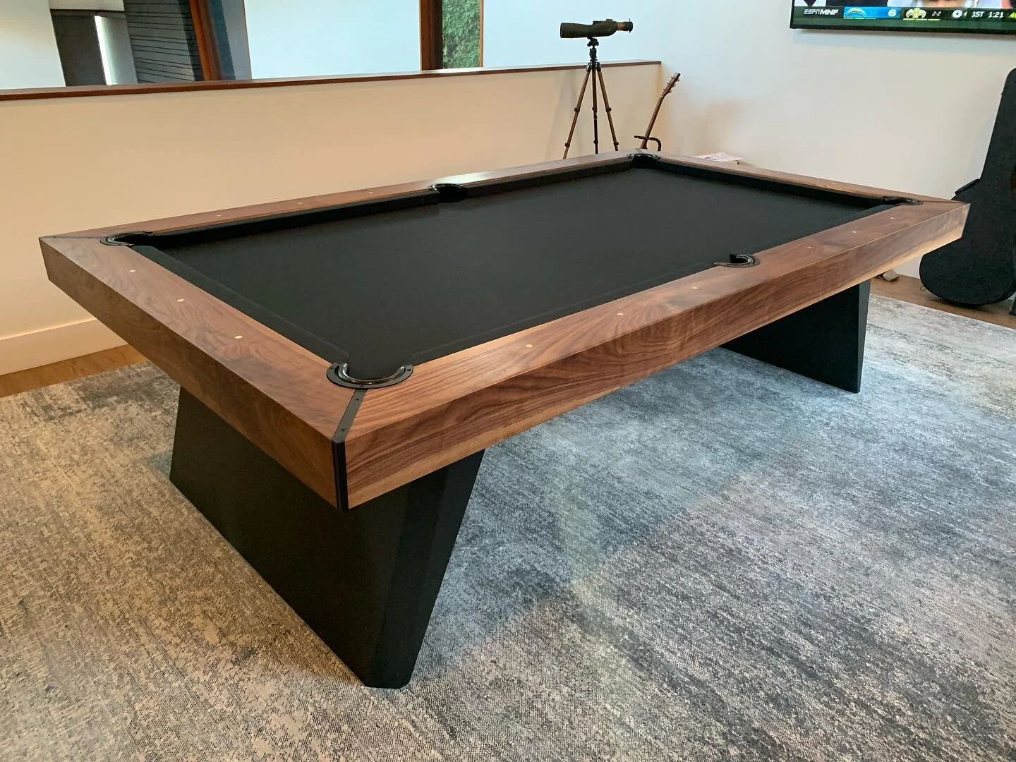 Our version of a pool table...and a ping pong table. Table top comes apart in 4 panels and conveniently tucks away into one of the integrated drawers on the base. All accouterments are neatly organized into the other. #pooltable #pingpongtable