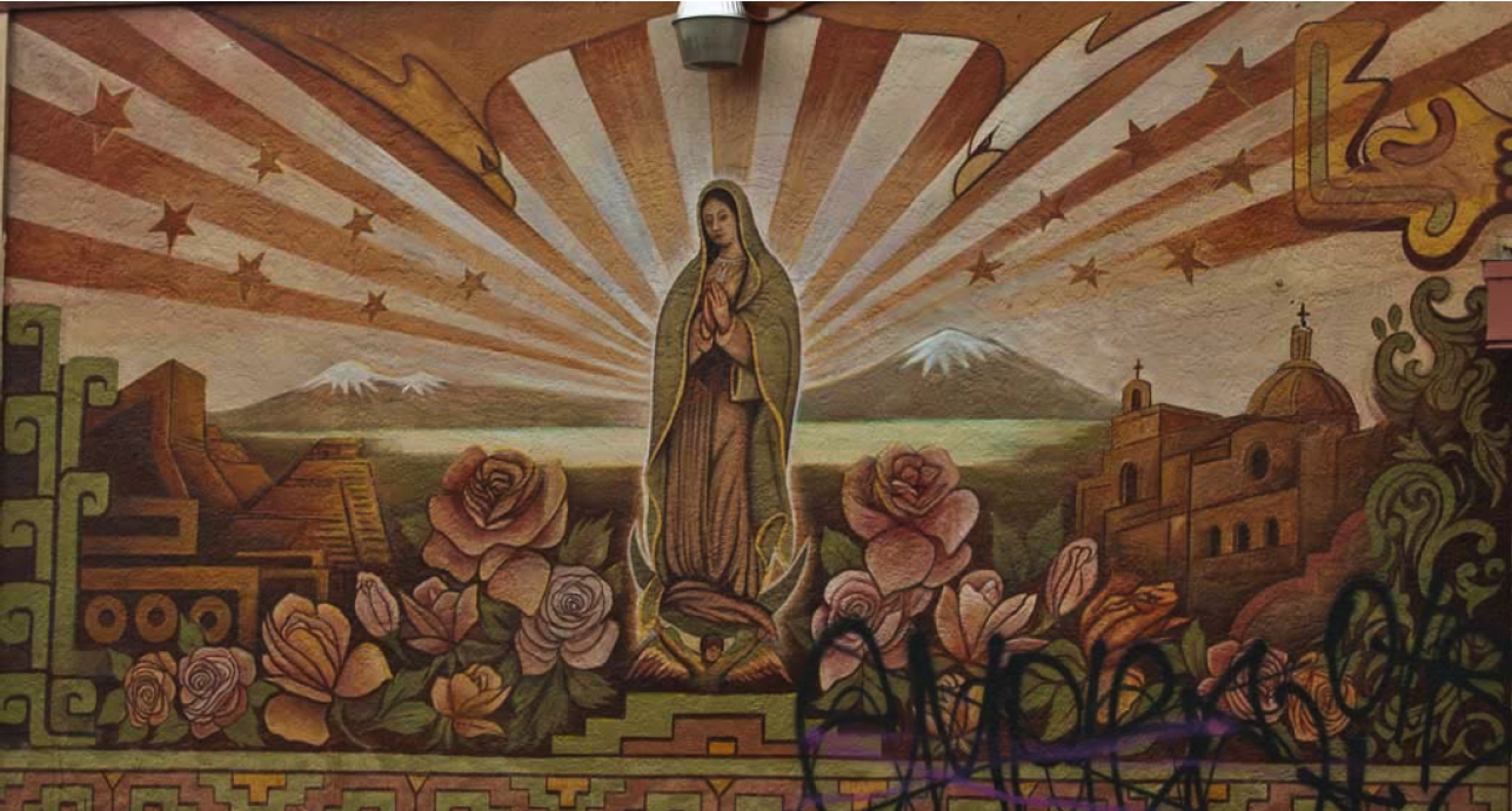 A mural adorns a wall along International Boulevard