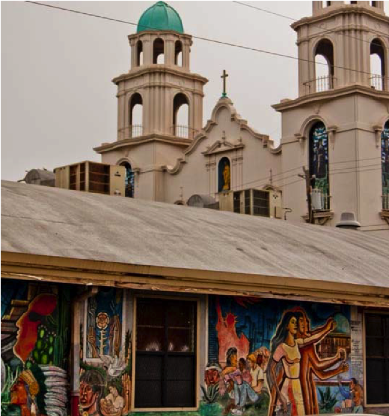 Murals seen on a school wall with St. Elizabeth Church in the background