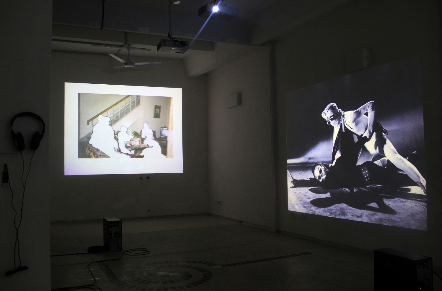  Exhibition view, to the left is Rabbya Naseer and Hurmat Ul Ain,&nbsp; Reenactment  (2012) and at right, Mehreen Murtaza,&nbsp; This Film Should Be Played Loud  &nbsp;( 2012). Photograph by Sadia Shirazi.&nbsp; 