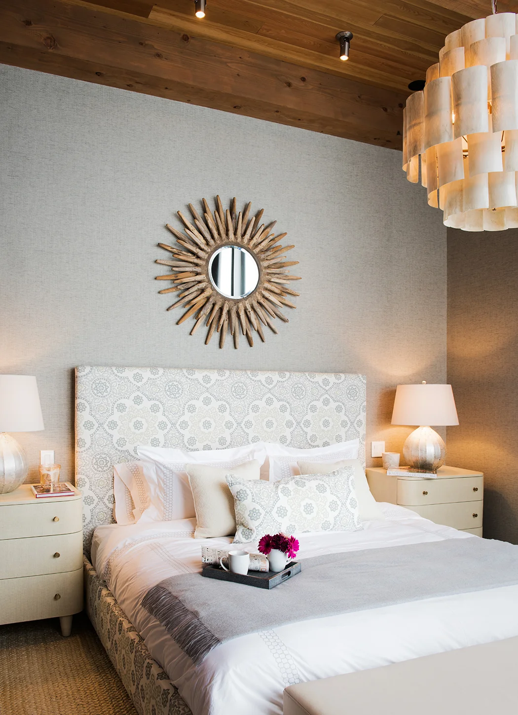 I love this bedroom, the interior designers did a great job with the furnishings! The pink in the flowers added the extra pop of color to really draw in your eye.