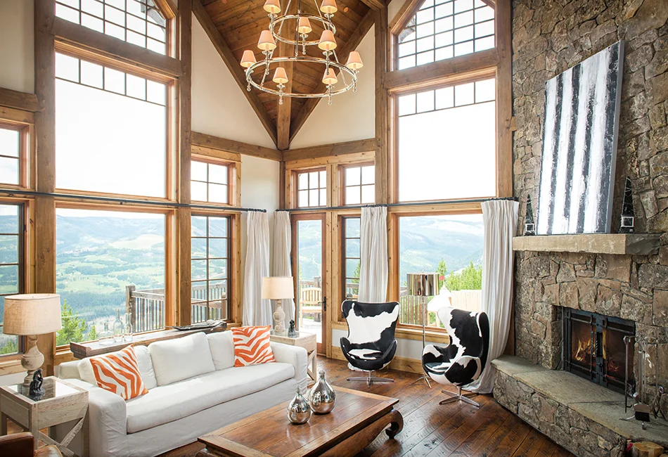 I love when interior designers choose the unexpected and surprise me with the cool patterns. I love the animal prints and pops of color in this room. The views aren't too shabby either!