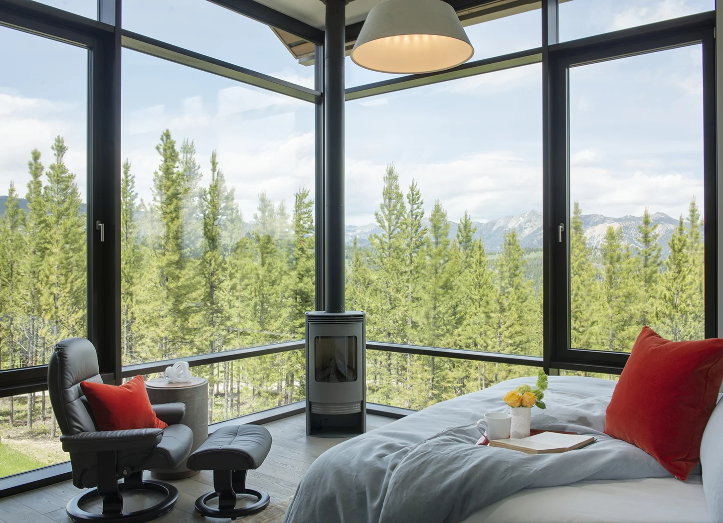 The large windows make me want to stay in this room all day! I can imagine cuddled up watching the sunset or a winter storm blow through.