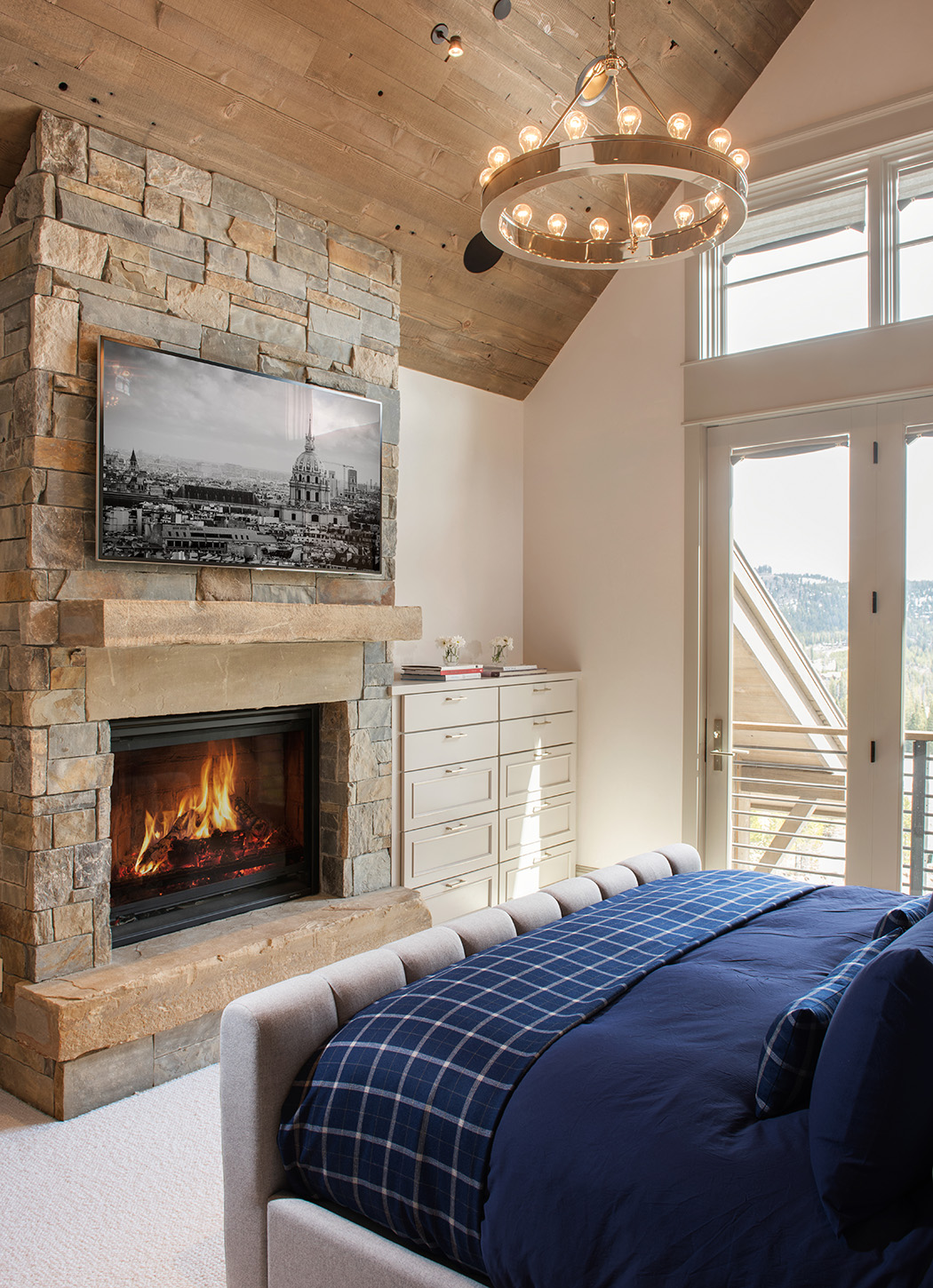I love the cozy bedrooms. The floor-to-ceiling fireplace adds that touch of warmth! 