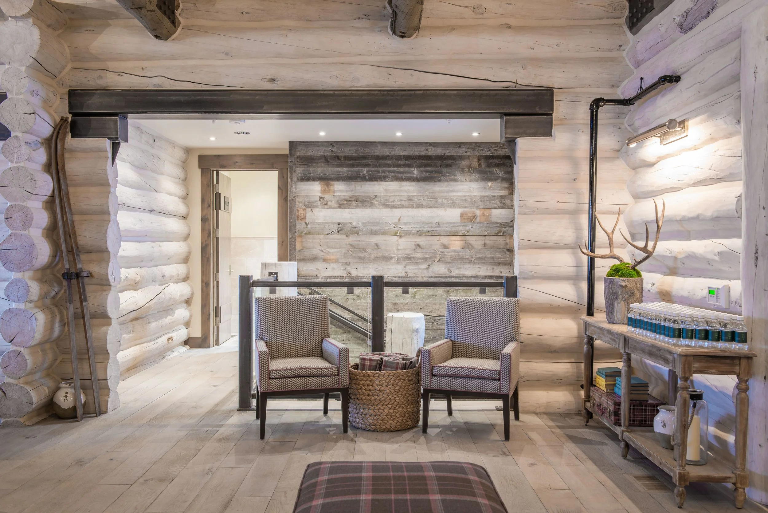 I love this shot of the front entry - a cozy space with modern touches. The original entry was really crammed and always caused a traffic jam. Opening the space makes the lodge feel more welcoming.