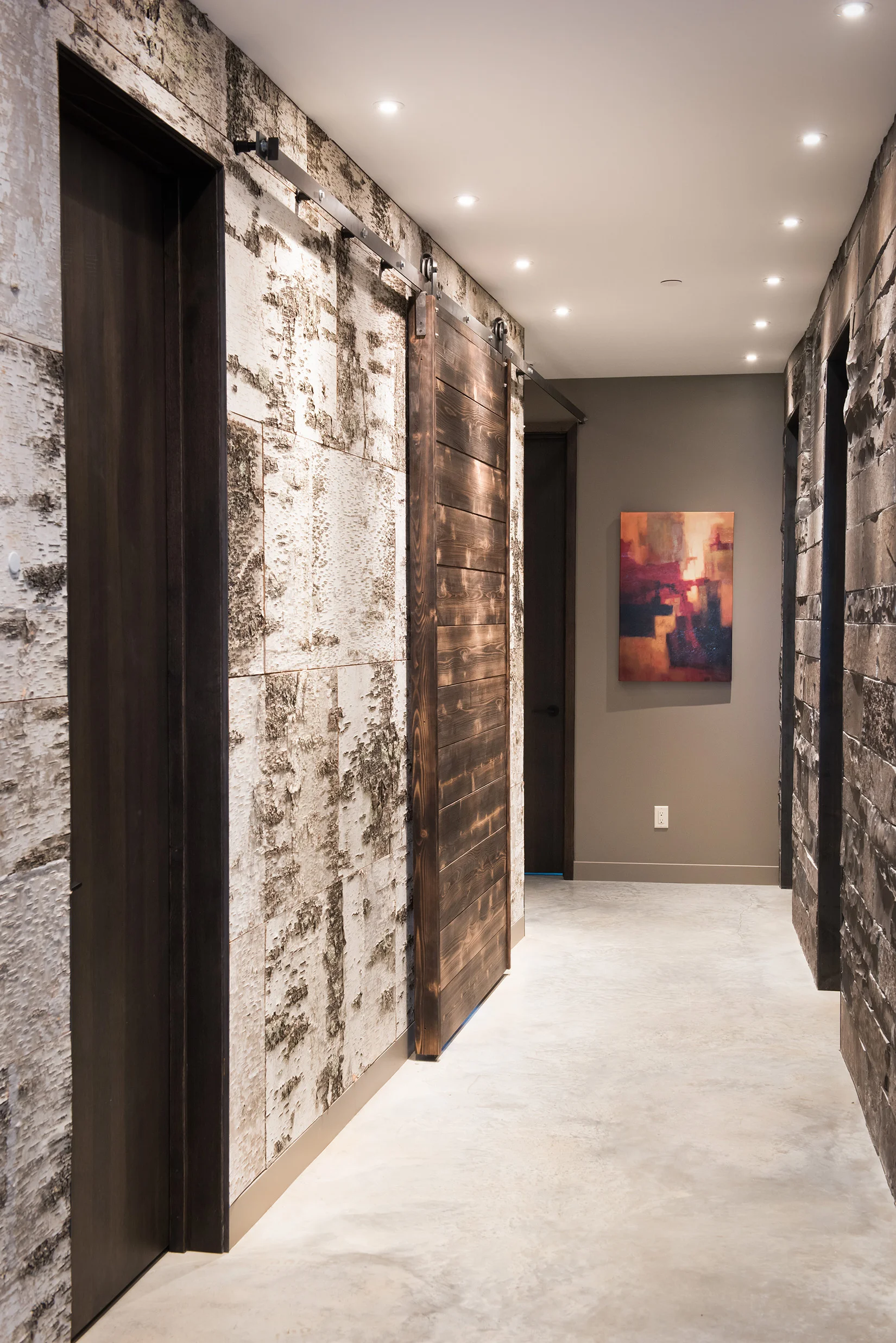 The perfect mixture or birch wallpaper, timber, and stone.