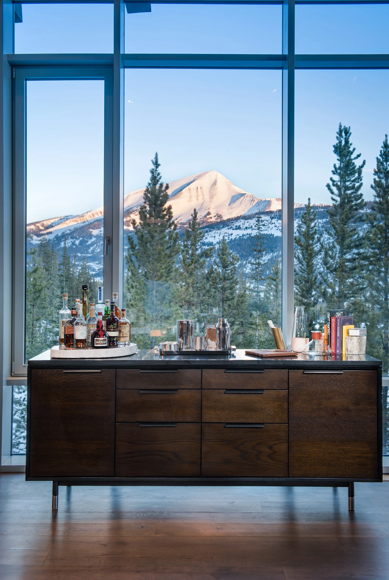This bar was shot up at golf course at Yellowstone Club. We took this shot as the early morning light was just starting to shine on Lone Peak. 