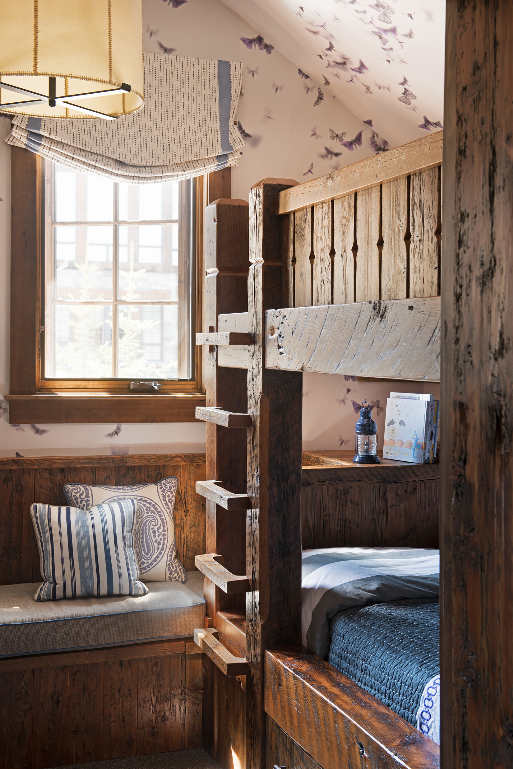 This bunkbed was custom made for this space and I absolutely love the butterfly wallpaper!