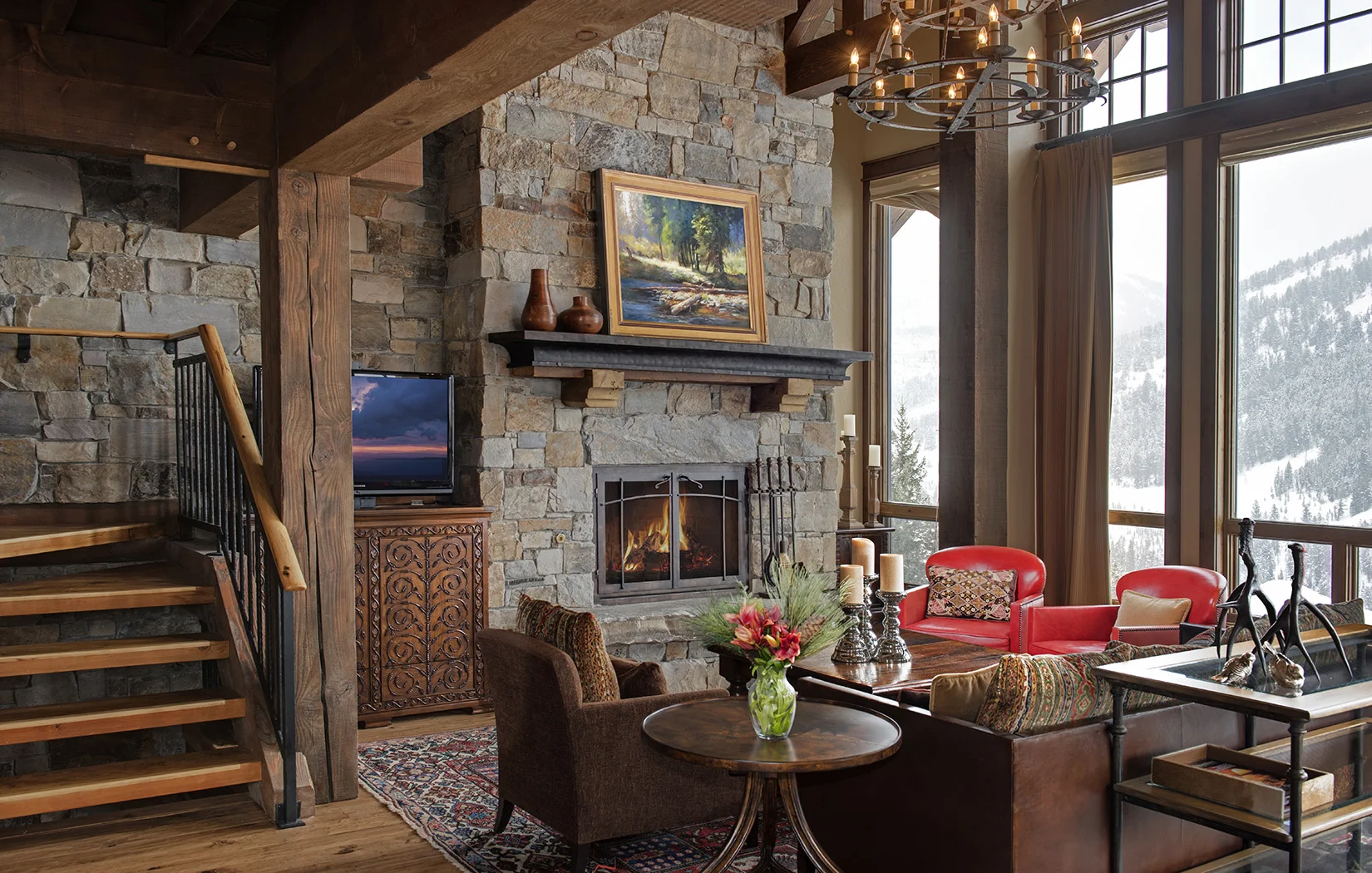 This cozy great room is sitting on the edge of the ski hill at Yellowstone Club . The pops of color really make the room come alive. Architect - Locati Architects
