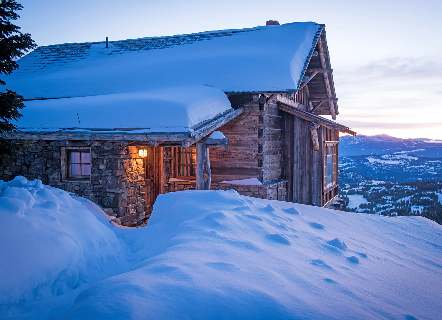 This quaint guest cabin sits high on Andesite Mountain in Yellowstone Club. The views of the sunrise are incredible! You almost feel like you are on the edge of the world!