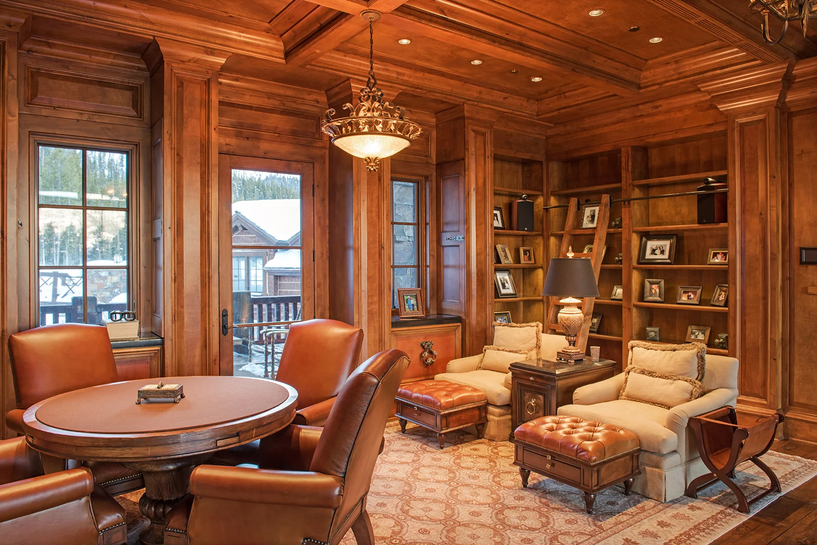 The classic library has it's own private deck and looks out over the great room.