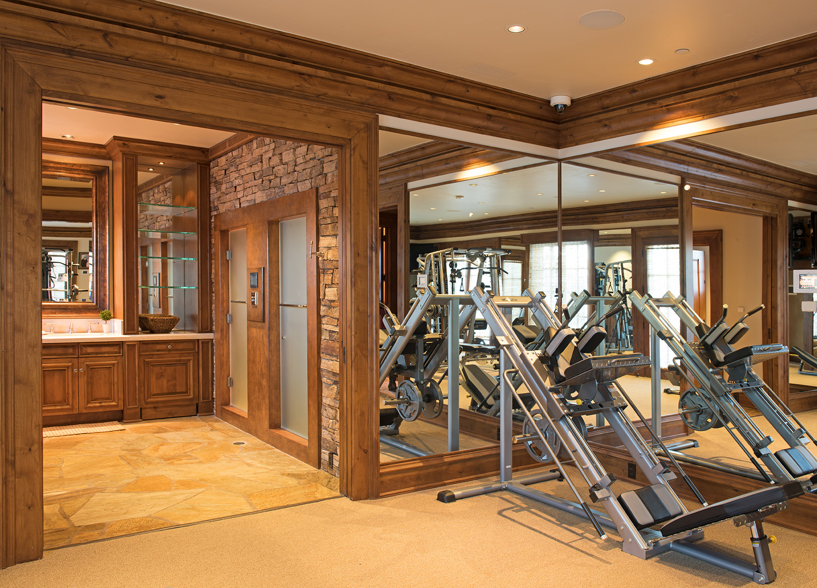 Huge work out room and steam shower with walk out access to the hot tub.