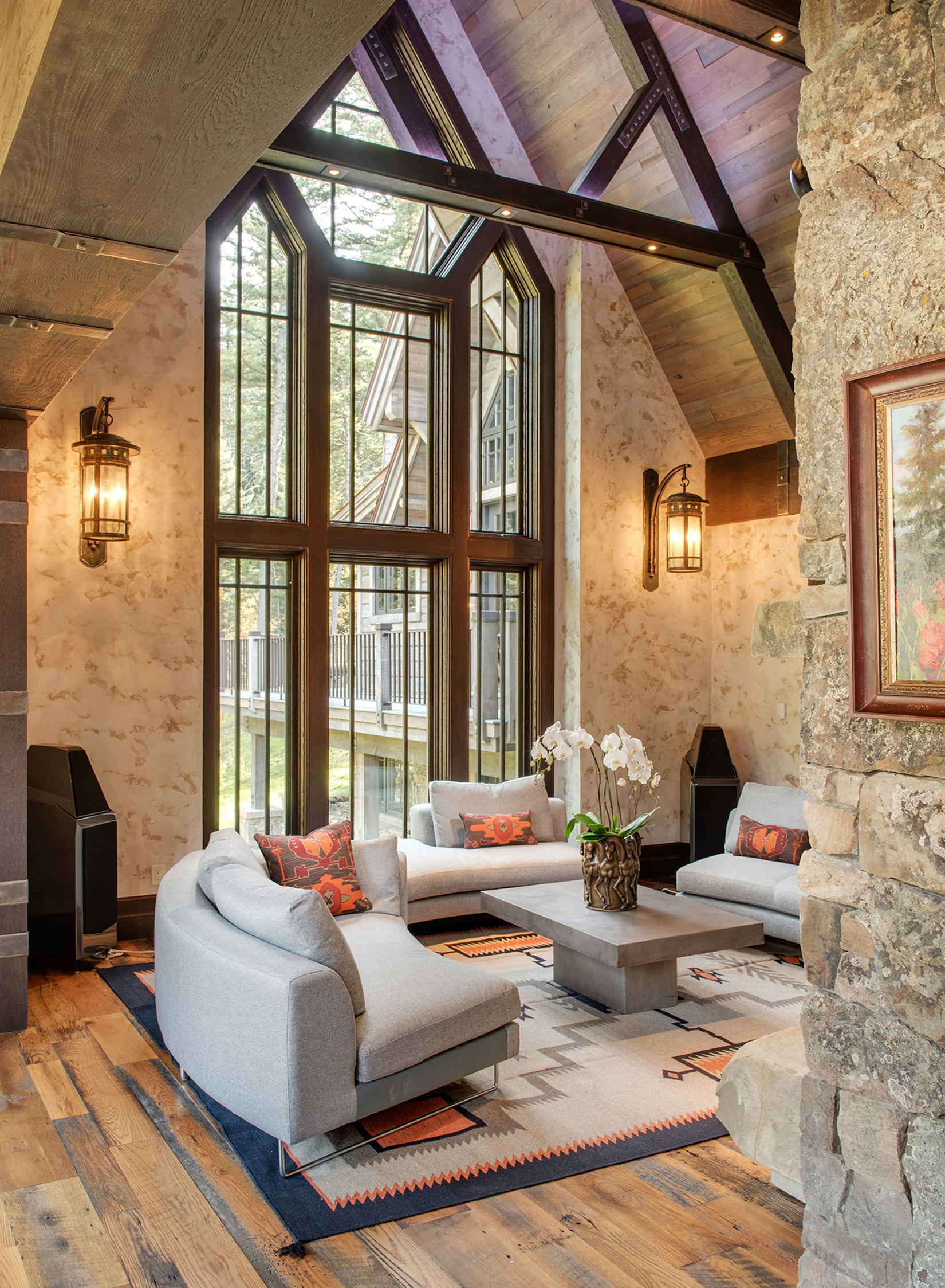 The entry of the home opens up to this stunning great room with floor-to-ceiling windows. I love the furnishings in this room too!