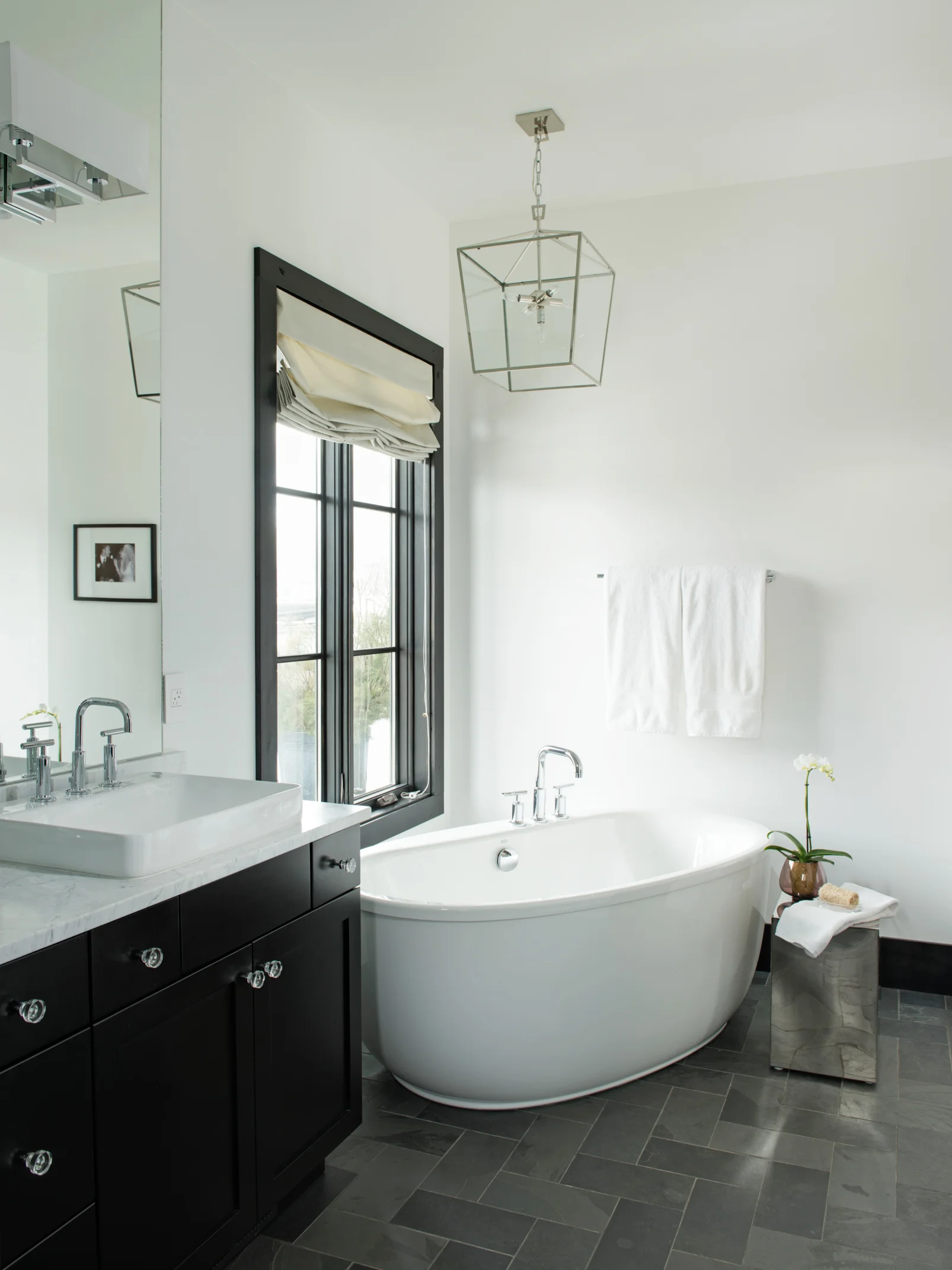 This bath is STUNNING! I love the simple and classic blacks & whites, and that tub!!