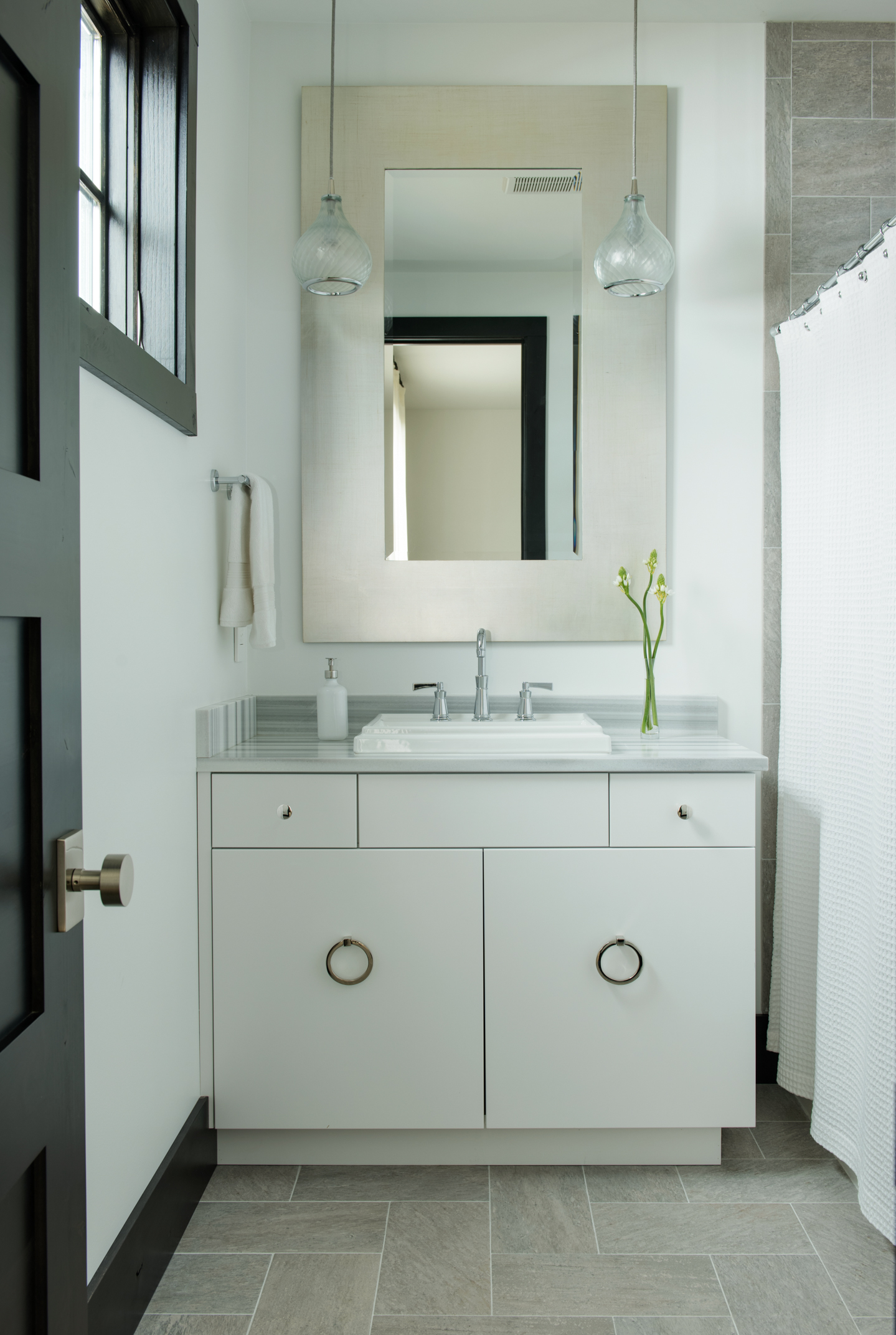 This stylish guest bath is so simple and clean. 