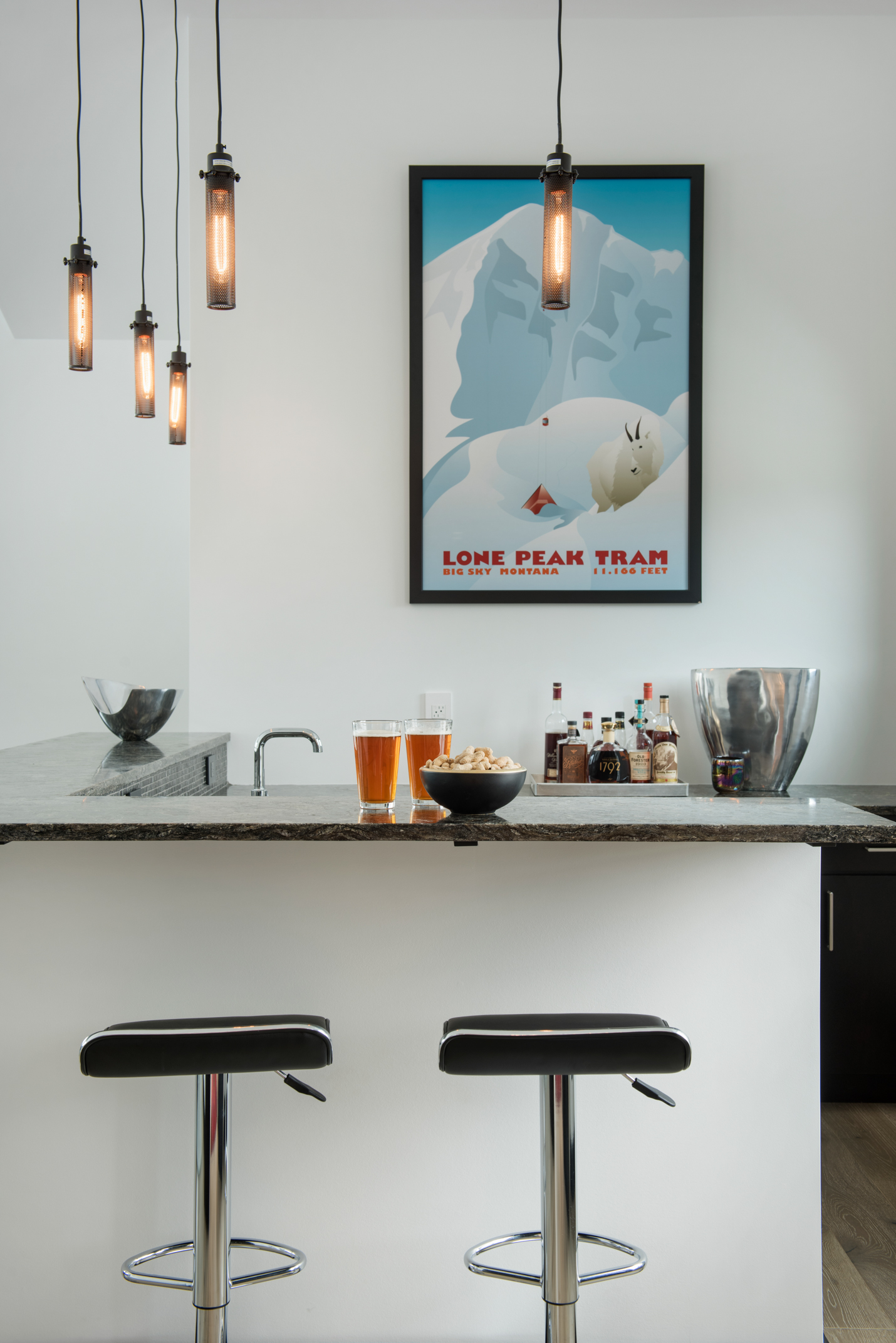 What's a house without a custom bar? The bar feels so sophisticated and bright - the perfect place to have a cocktail!