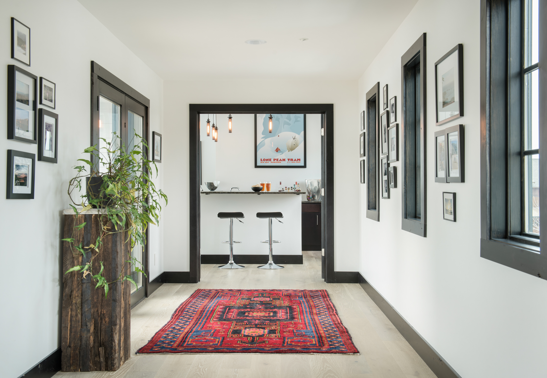 The breezeway connects the bar to the rest of the home. The natural light in this home is astounding.