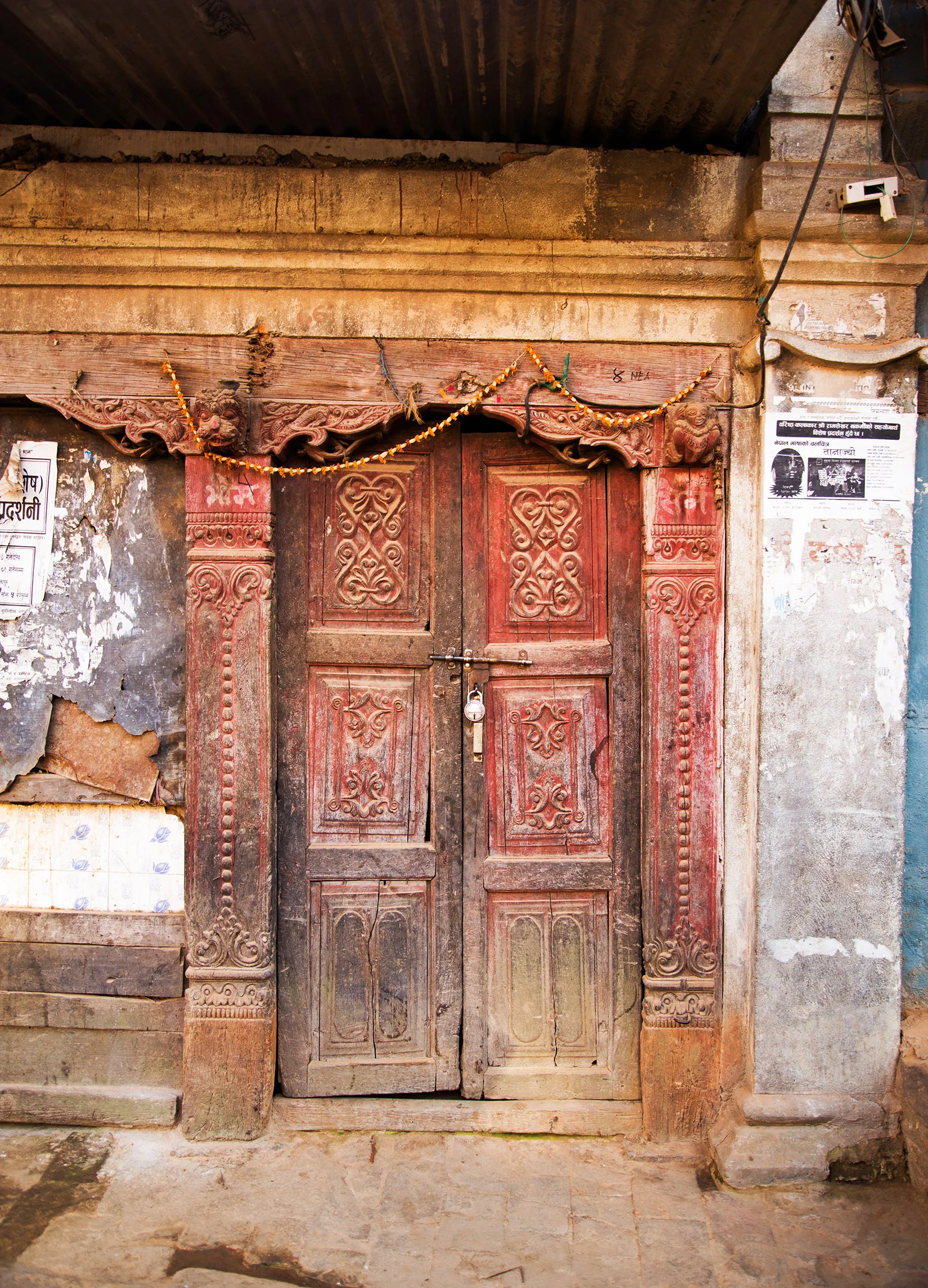 The reds and all the cracks in this door tell a story of history and life. I am enthralled with the carvings throughout the door and frame. Love!!