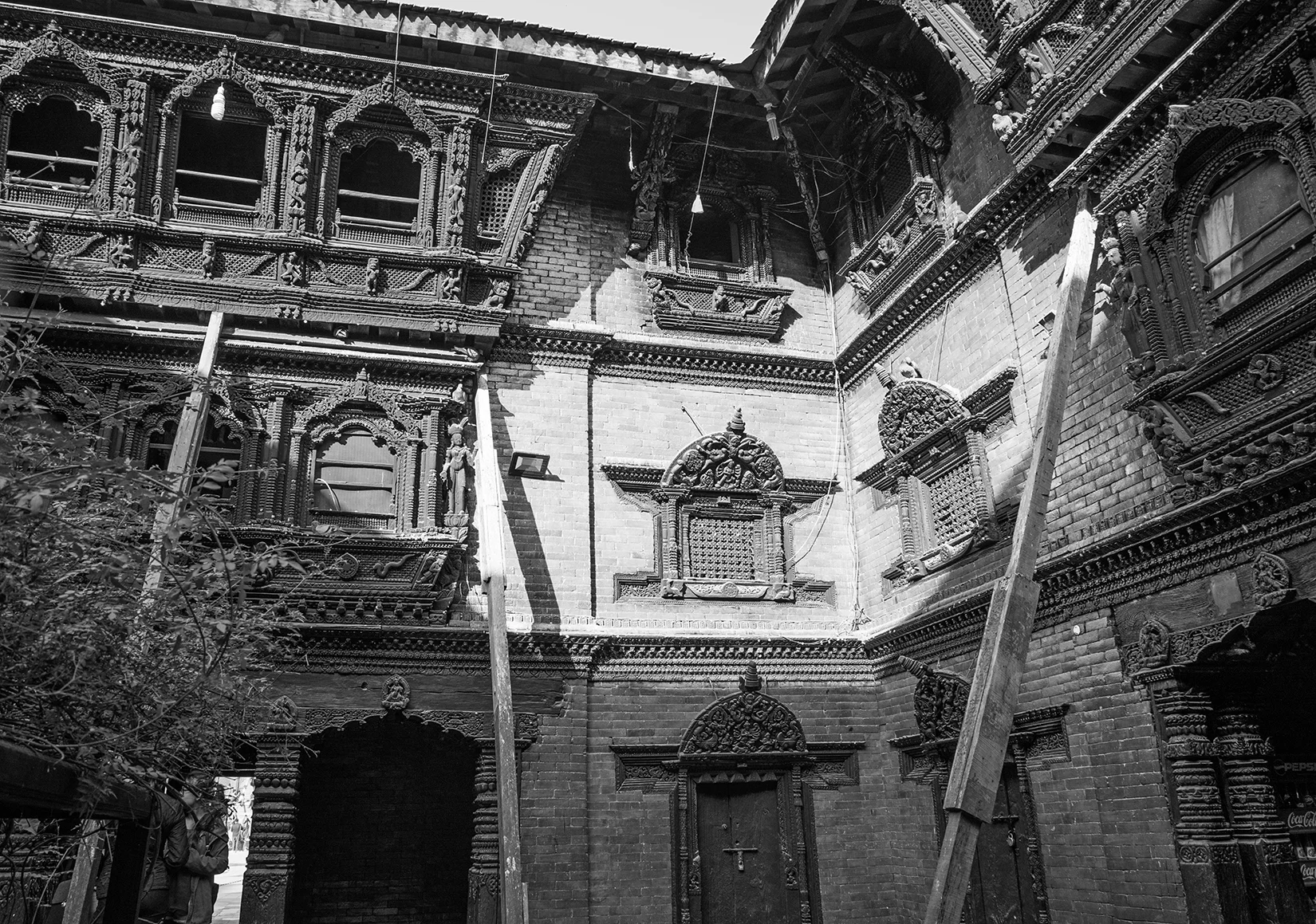 Though not technically a door, this courtyard has amazing design in all of the windows. The wood carvings mixed with the brick is truly art!