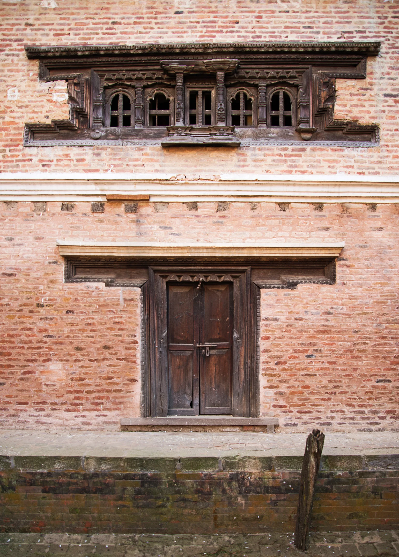 The combination of the the wood and brick is incredible. I love the color in the moss growing on the walkway - it adds so much character and sense of history to an already beautifiul architectural site.