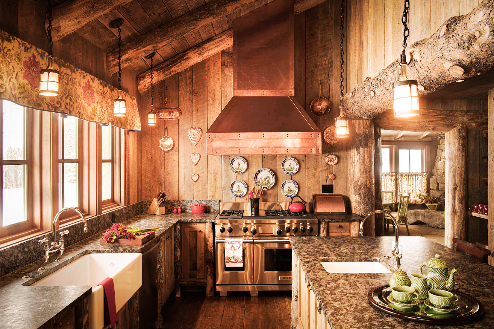 This kitchen is all rustic, from the farmhouse style detail, to the exposed beams, to the wood planked walls... love! Located in Yellowstone Club