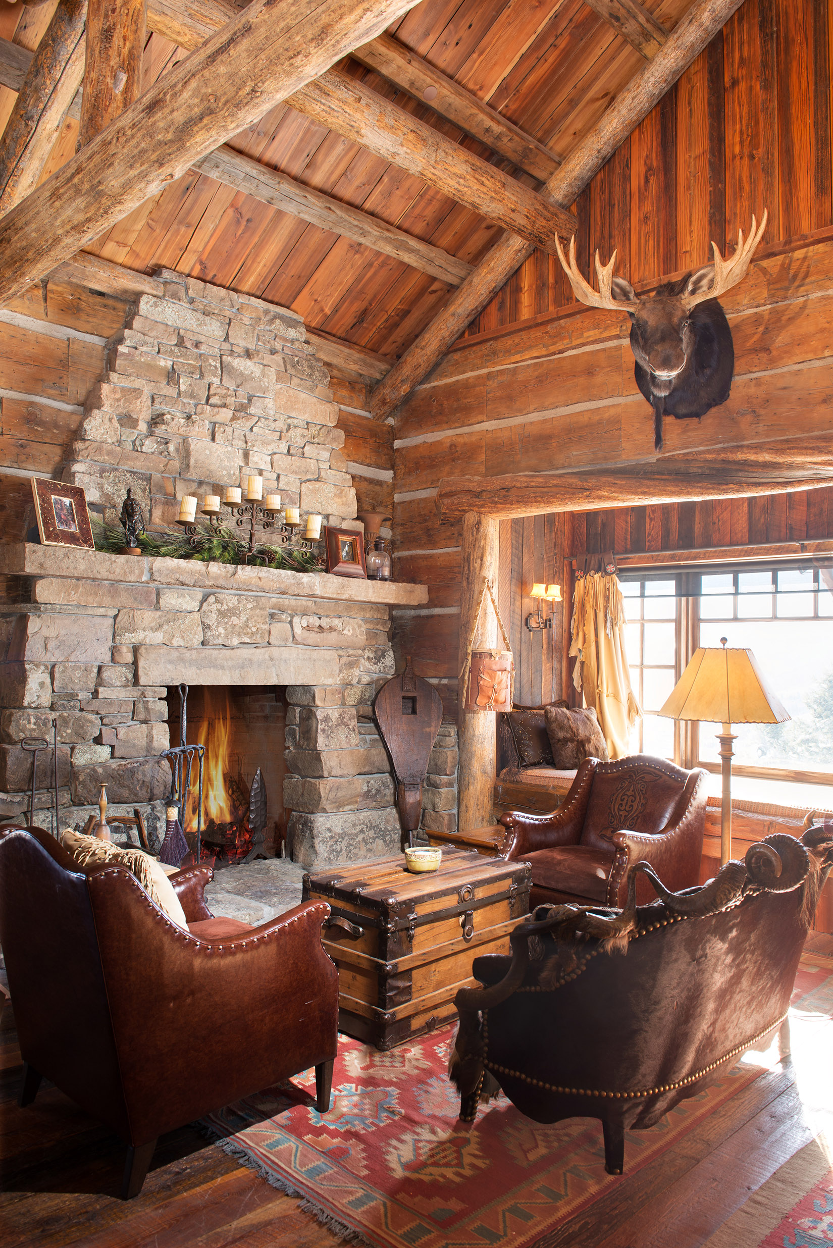 The rustic architecture is so cozy in this home. I could definitely sit next to this fireplace and enjoy a nice warm beverage for a long time! Located at Yellowstone Club .