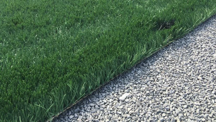 Turf gets laid out on gravel base.