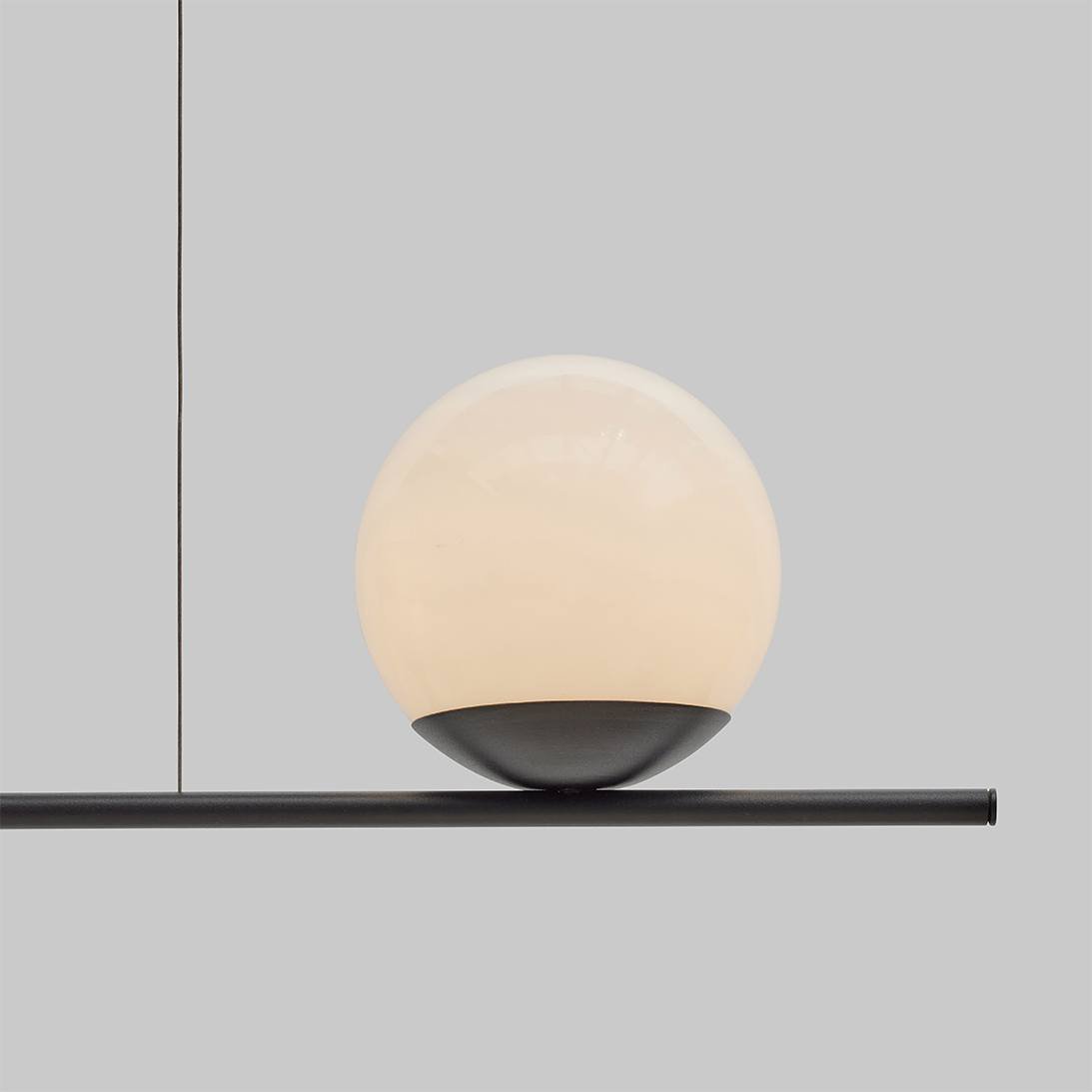 This elegant light fixture features dual opal acrylic spheres, each beautifully capped with a sleek brass finish. The spheres are mounted on a refined 13mm tube, creating a minimalist yet sophisticated design. Expertly designed and handcrafted in Aus