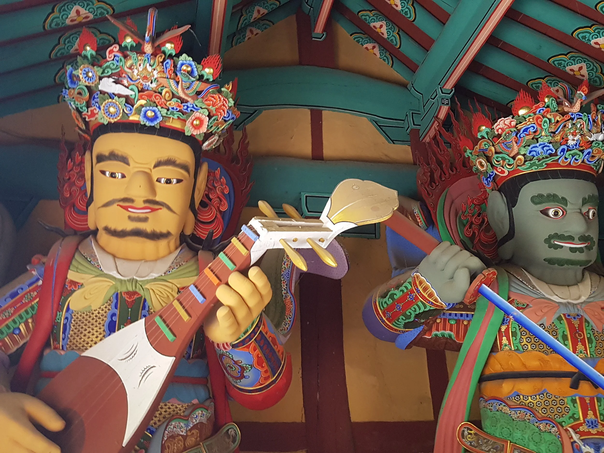 Statues depicting Buddhist Characters guarding the temple. 