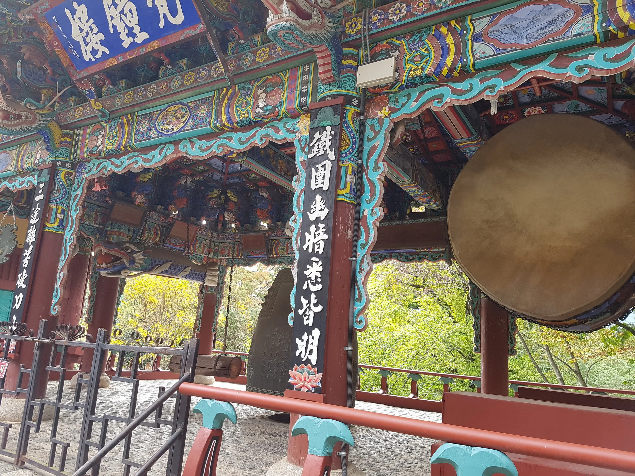 A temple building with a large bell and drum